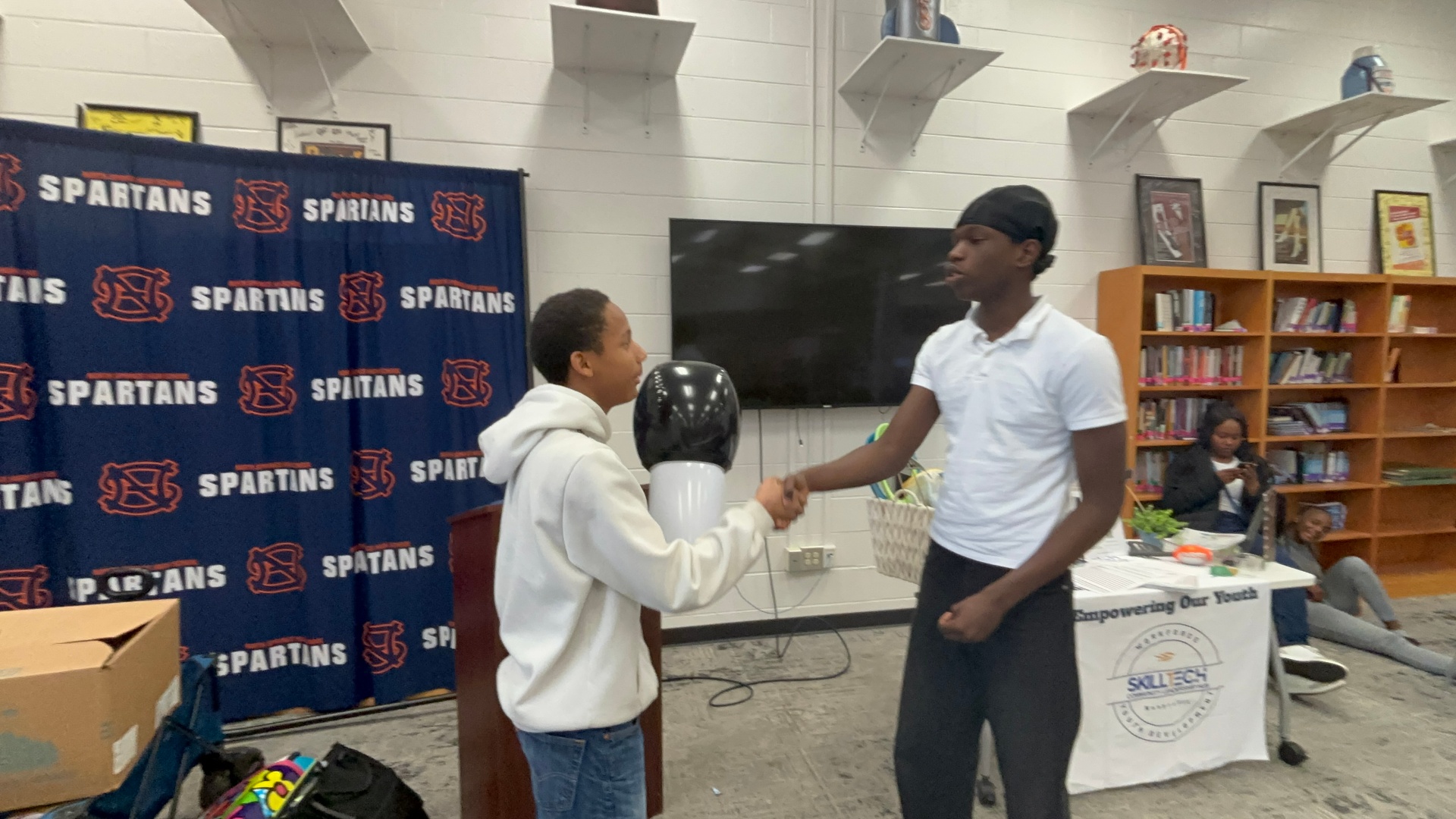 Students practicing handshakes